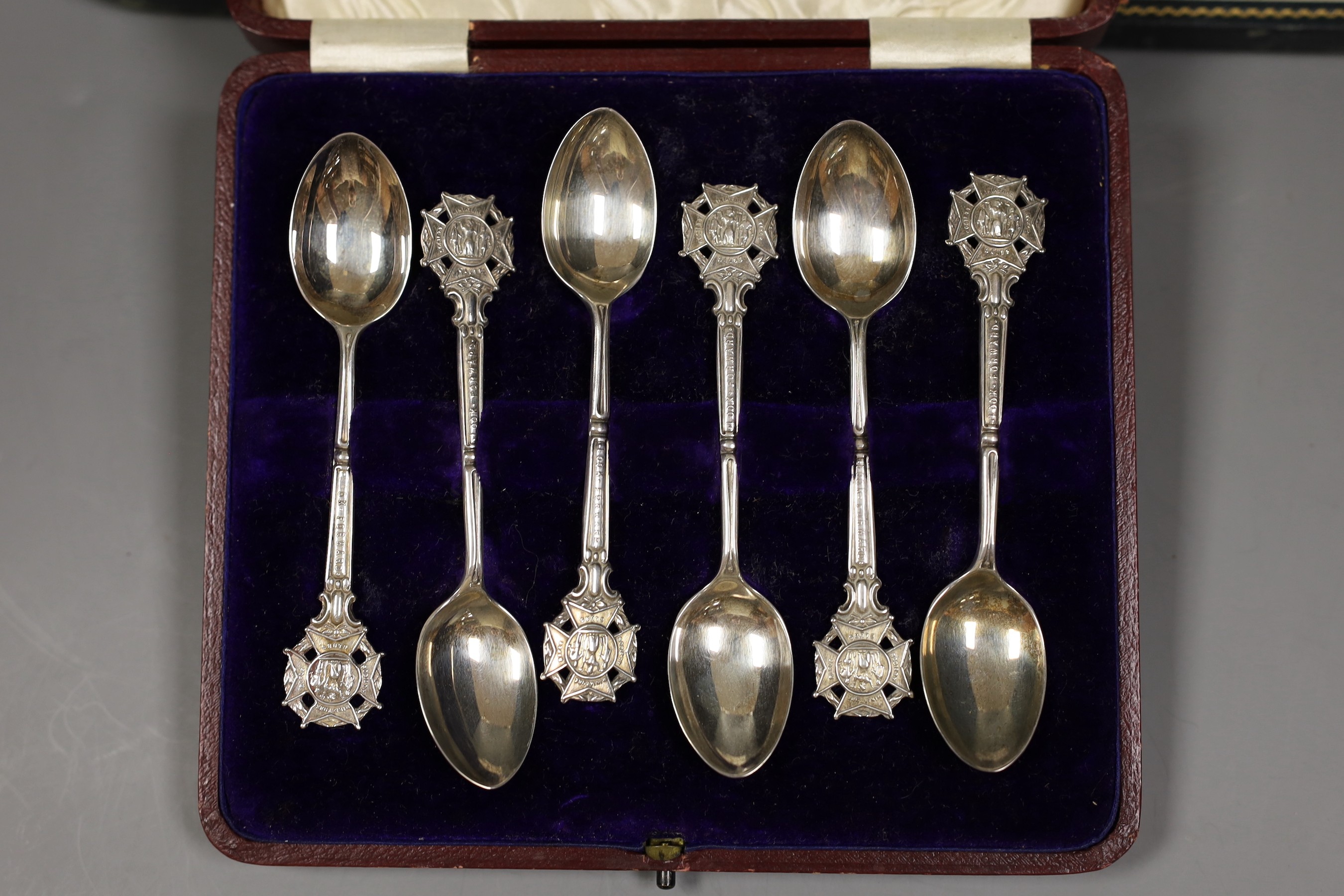 Rifle trophies: a cased set of twelve spoons, two cased sets of silver spoons and a cased set of six plated spoons